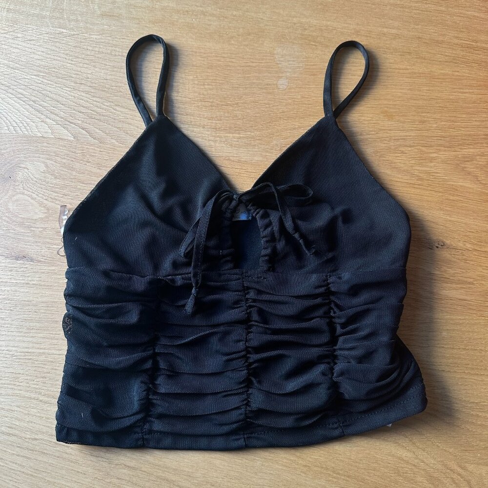 Black spaghetti strap top, ruched and with center chest tie.